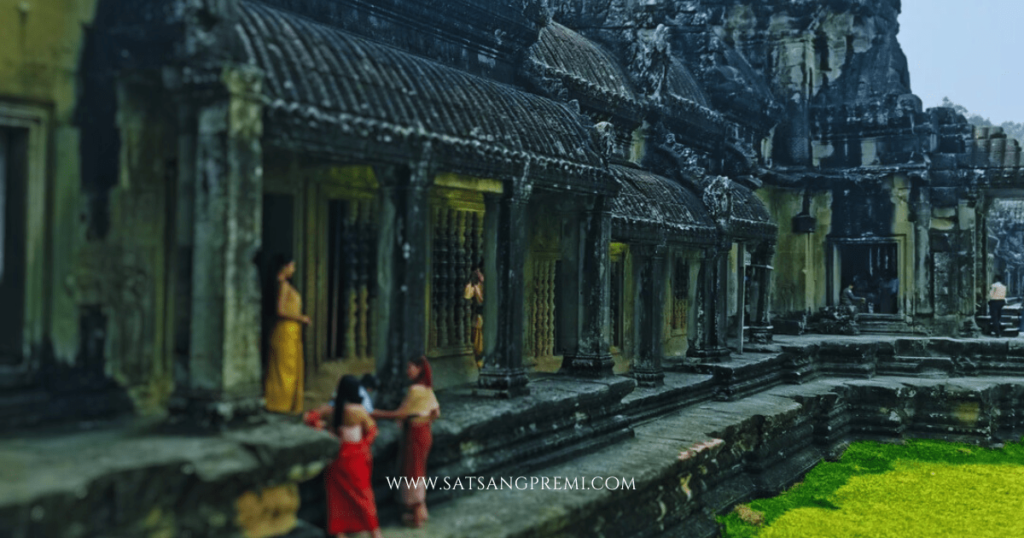 image of Monks walking in the corridor of Angkor Wat – represents culture and peace